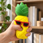 Jumbo Pineapple Squishy with Sunglasses, being squeezed by hand, soft and squishy
