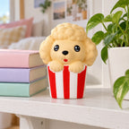Puppy squishy jumbo, on a shelf with books and a plant as room decor