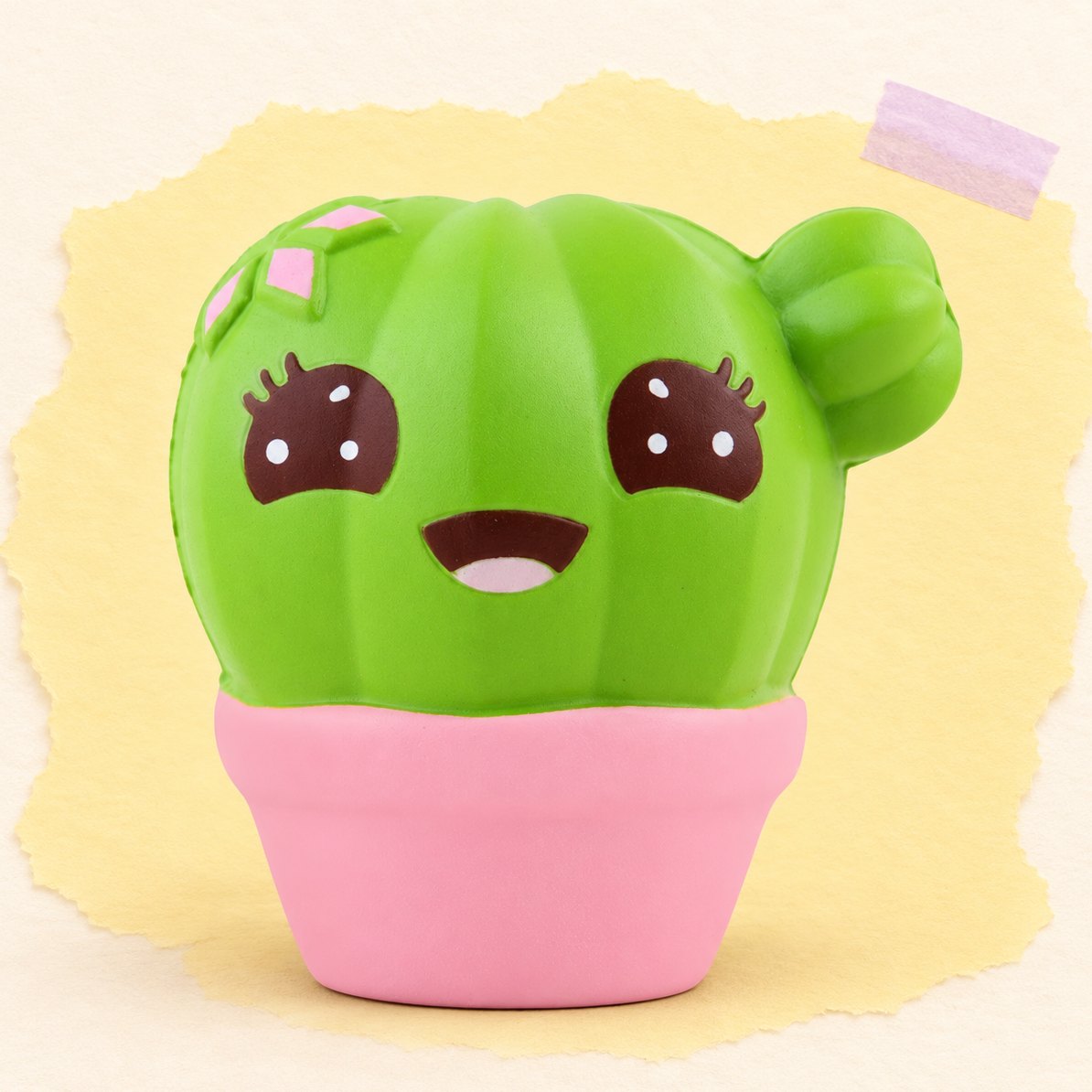 Kaktus-squishy, kawaii, produktfoto på pastelfarvet papir