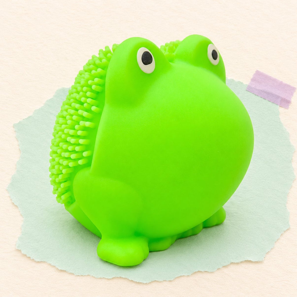 Kikker squishy met zachte stekels van TPR, 5 cm, op pastelkleurig papier