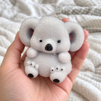 Koala Squishy, Fuzzy Soft TPR, held toward the camera, first-person view