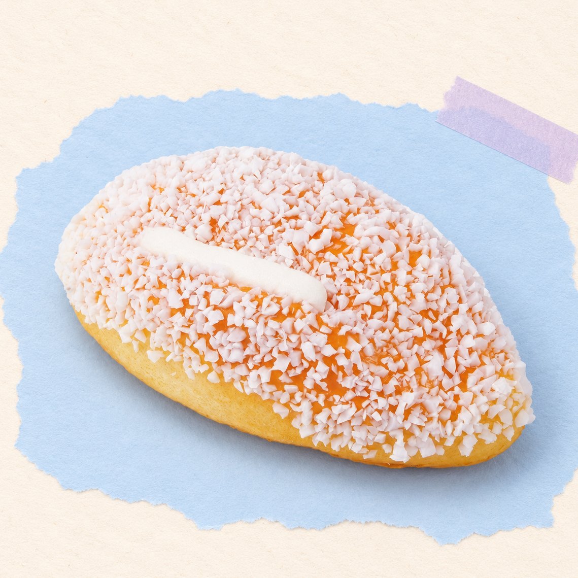 Kokosroombroodje squishy van 12 cm op pastelkleurig papier