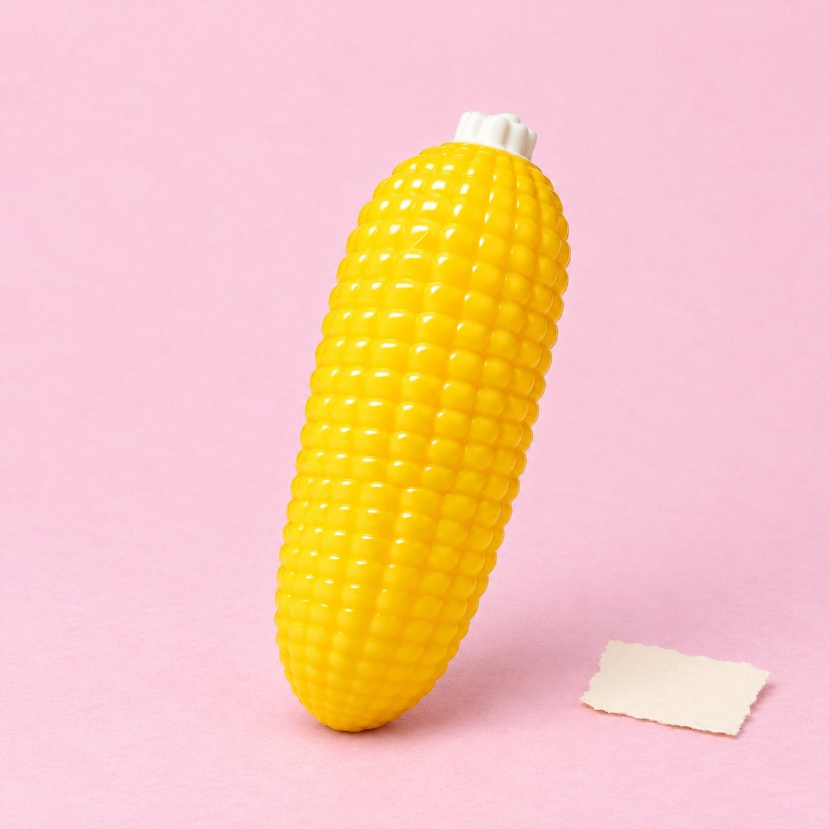 Maïskolf squishy, crunchy, op pastelkleurig papier