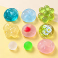 Maltose ball squishy set – Maltose Squishy Set, all 9 colors, product photo on pastel paper