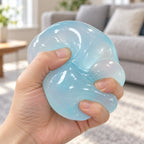 Maltose taffy squishy (Mint Blue), being squeezed by hand, soft and squishy