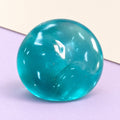 Maltose taffy squishy – Maltose Taffy Squishy, Slow Rising Gel Ball (Ocean Blue), product photo on pastel paper