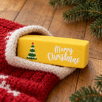Merry Christmas Butter Squishy, 6 Colors, Slow Rising (Yellow, Christmas tree), peeking out of a Christmas stocking