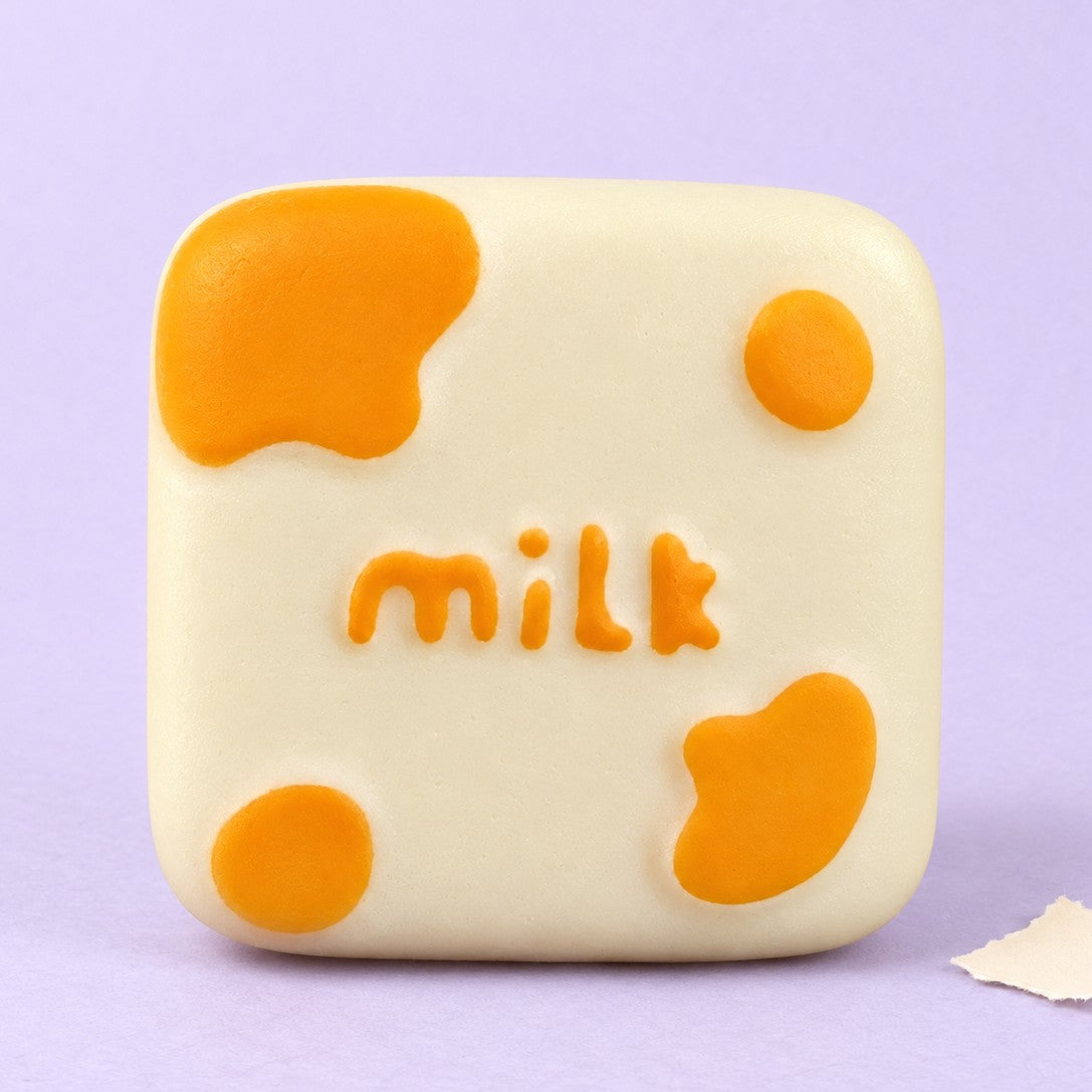 Milk block squishy – Milk Block Squishy, Kawaii Slow Rising, product photo on pastel paper