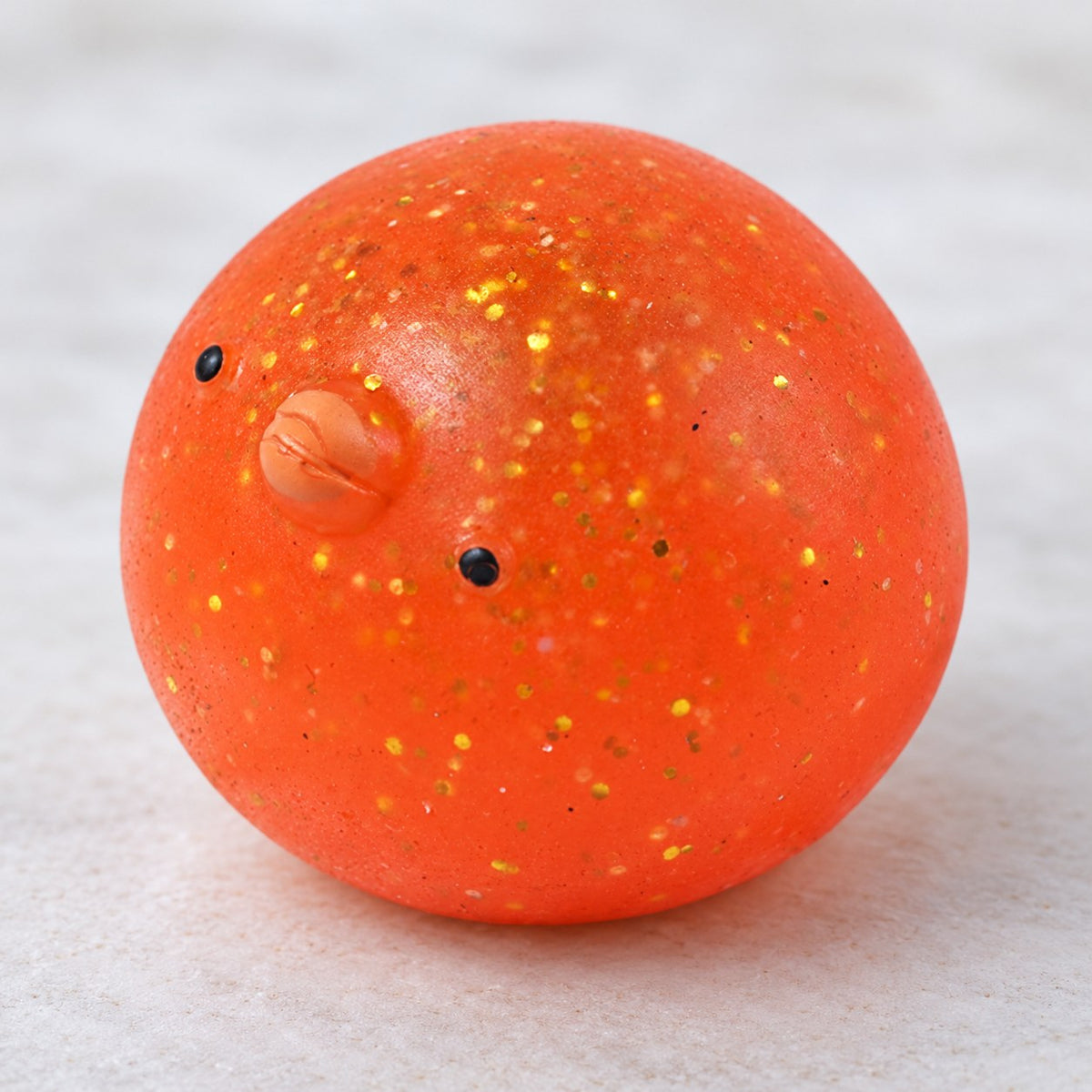 Mochi Squishy Chick with Glitter, close-up of the glitter
