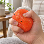 Mochi Squishy Chick with Glitter, being squeezed by hand, soft and squishy