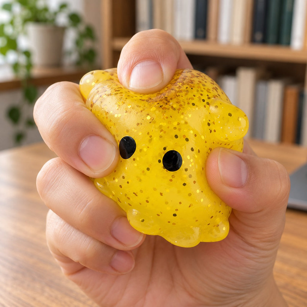 Mochi Squishy Octopus with Glitter, being squeezed by hand, soft and squishy