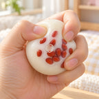 Red Bean Mochi Squishy, Handmade, being squeezed by hand, soft and squishy