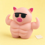 Pig squishy – Muscle Pig Squishy with Sunglasses, 12.5 cm, product photo on pastel paper