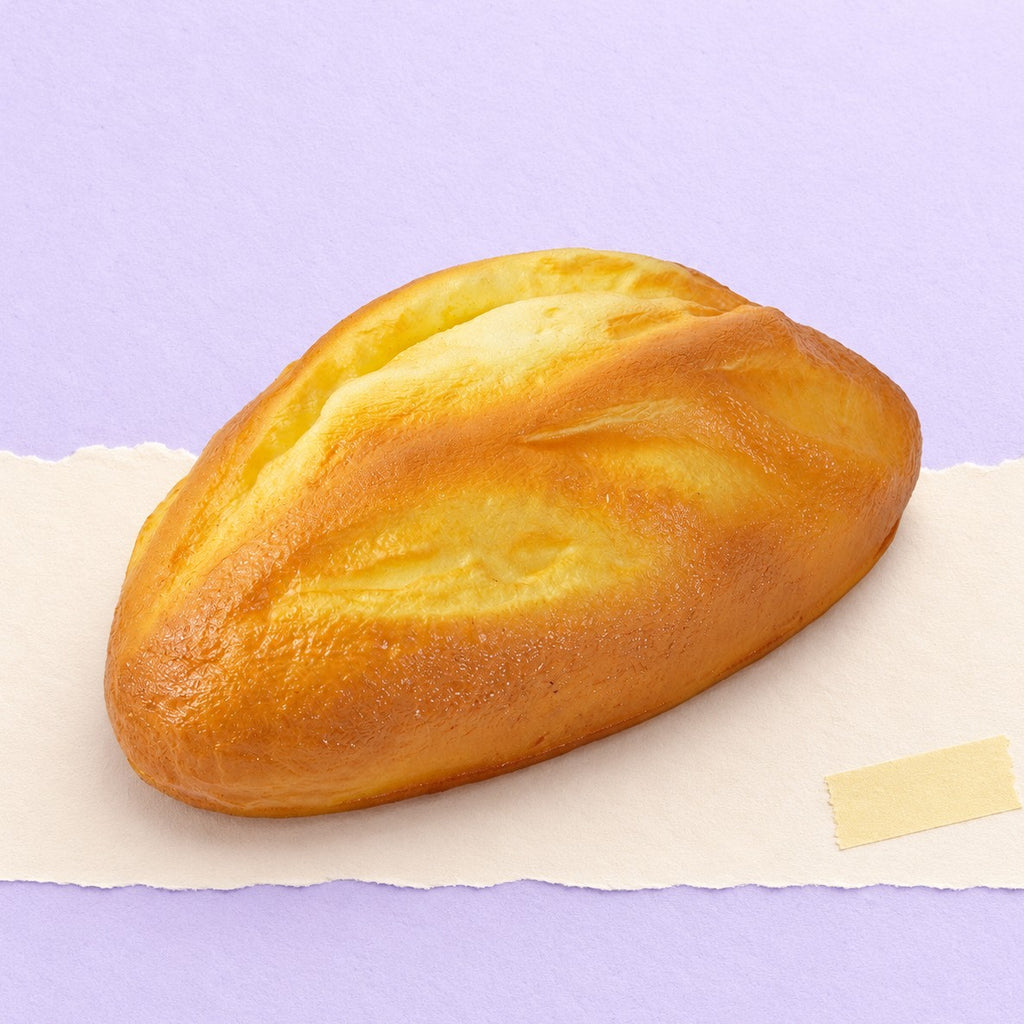 Oat bread squishy – Oat Bread Squishy, Rustic Loaf 18 cm, product photo on pastel paper