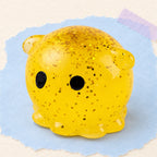 Octopus squishy mochi – Mochi Squishy Octopus with Glitter, product photo on pastel paper