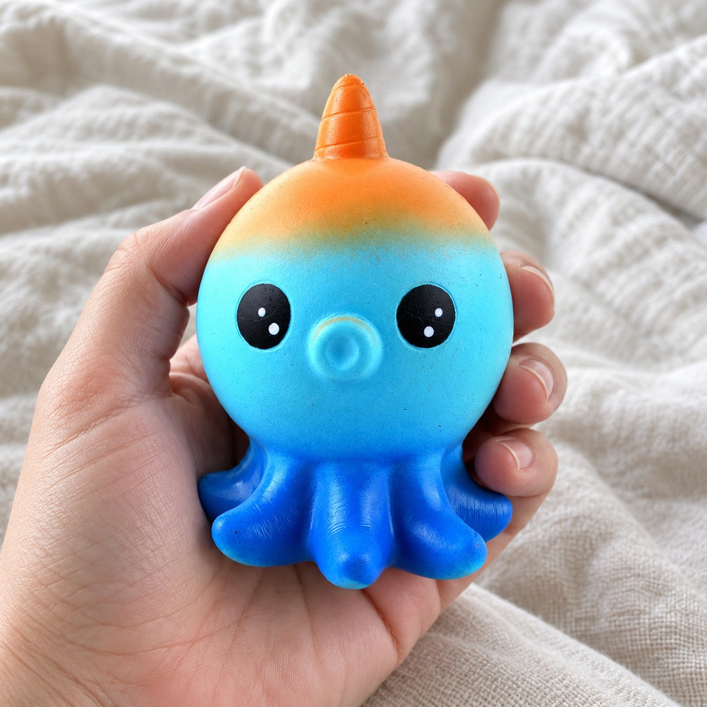 Octopus squishy slow rising, held toward the camera, first-person view