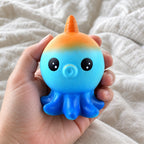 Octopus squishy slow rising, held toward the camera, first-person view