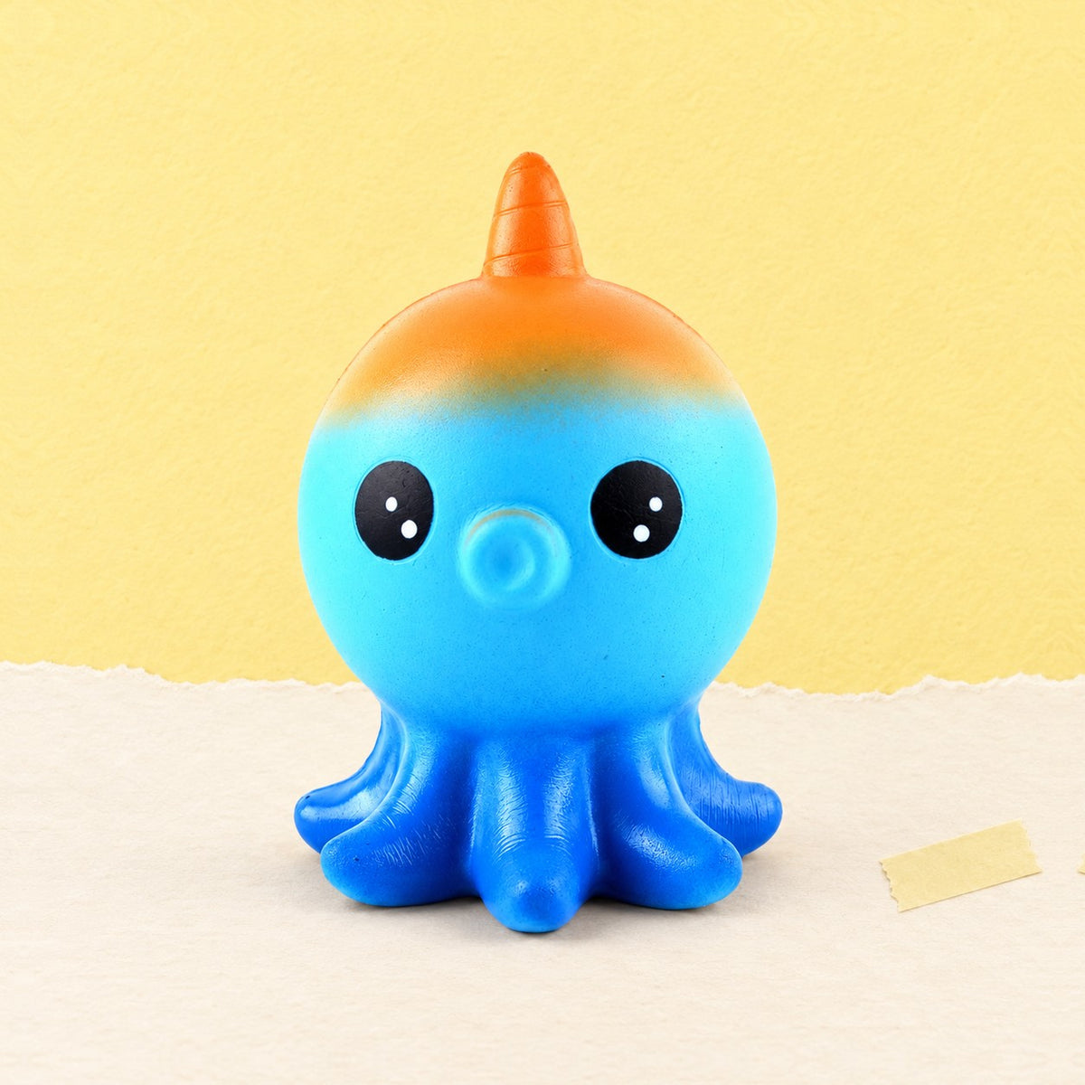 Octopus squishy slow rising, product photo on pastel paper