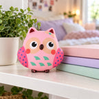 Owl squishy slow rising, on a shelf with books and a plant as room decor