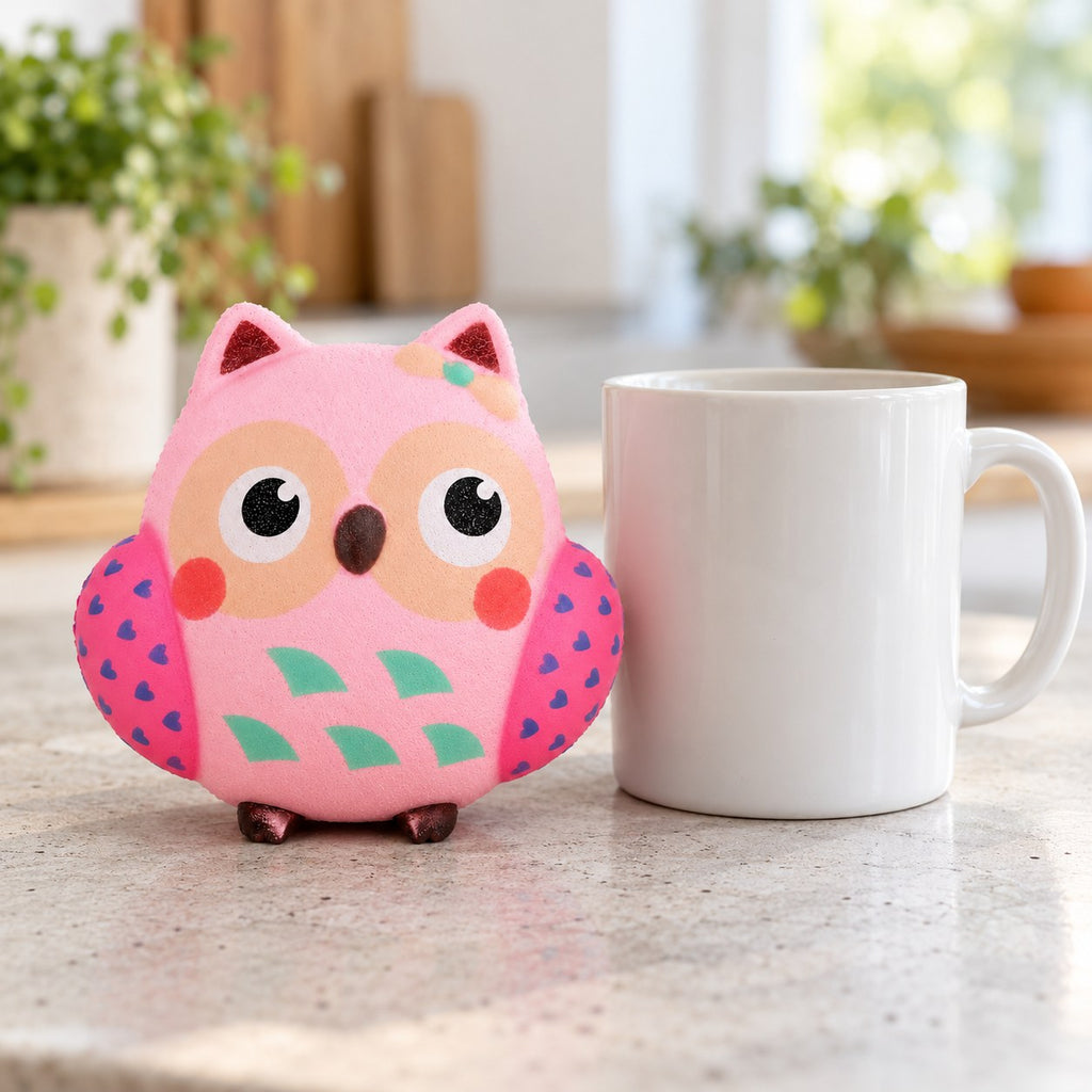 Owl squishy slow rising, next to a coffee mug for size comparison