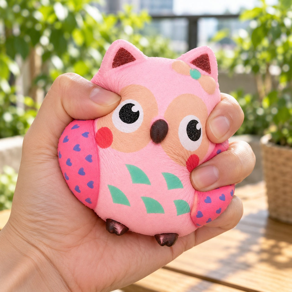 Owl squishy slow rising, being squeezed by hand, soft and squishy