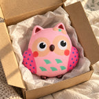 Owl squishy, unboxed from a parcel with tissue paper