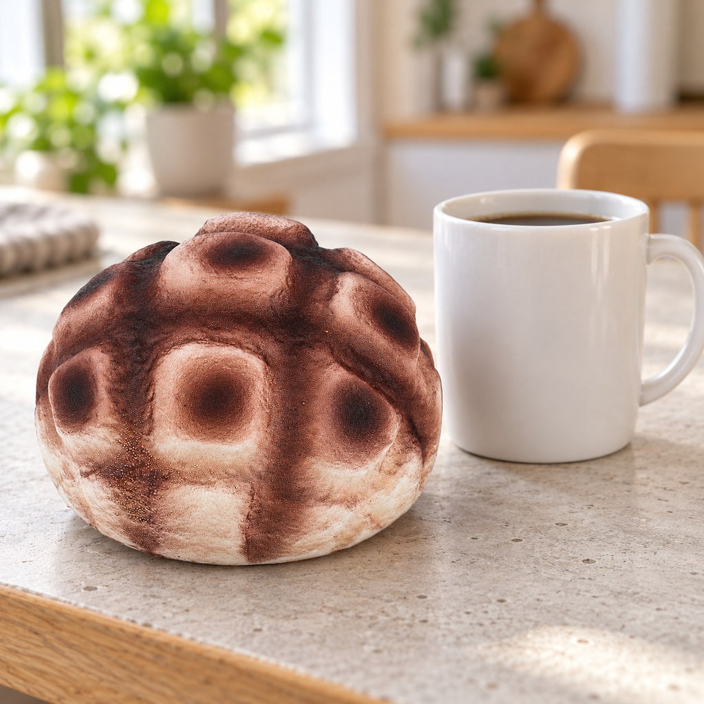 Pineapple bun squishy slow rising (12 cm, brown), next to a coffee mug for size comparison