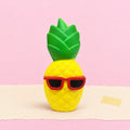 Pineapple squishy jumbo – Jumbo Pineapple Squishy with Sunglasses, product photo on pastel paper