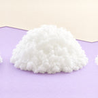 Papieren squishy vullen – Vulwatten voor papieren squishies, 1 kg, productfoto op pastelpapier