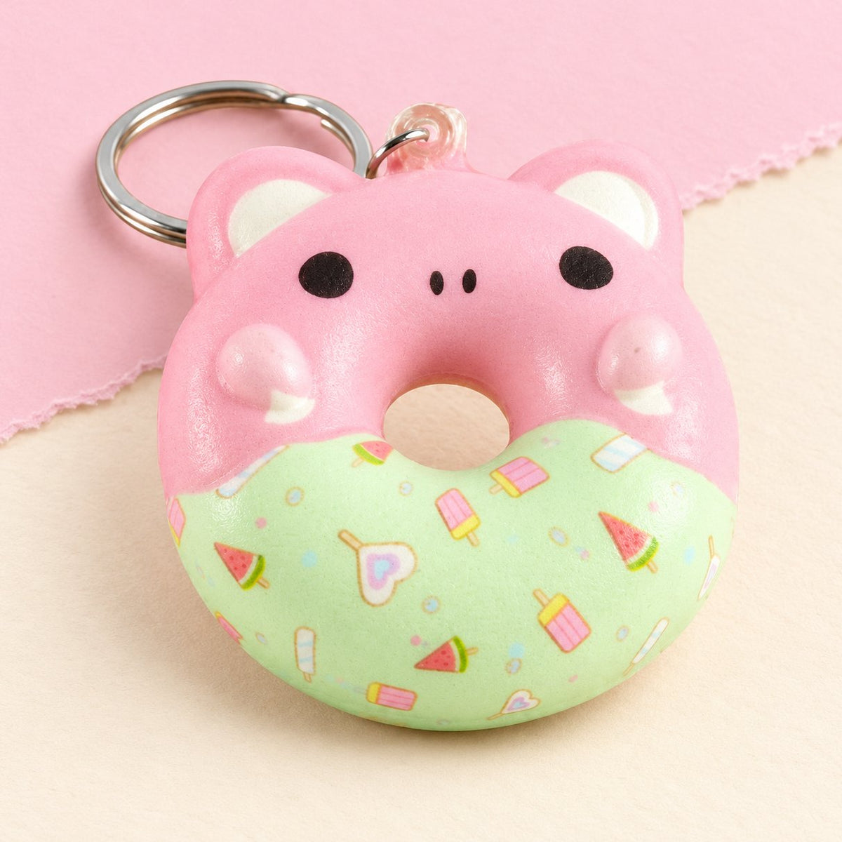 Portachiavi squishy ciambella con musetto di animale su carta pastello
