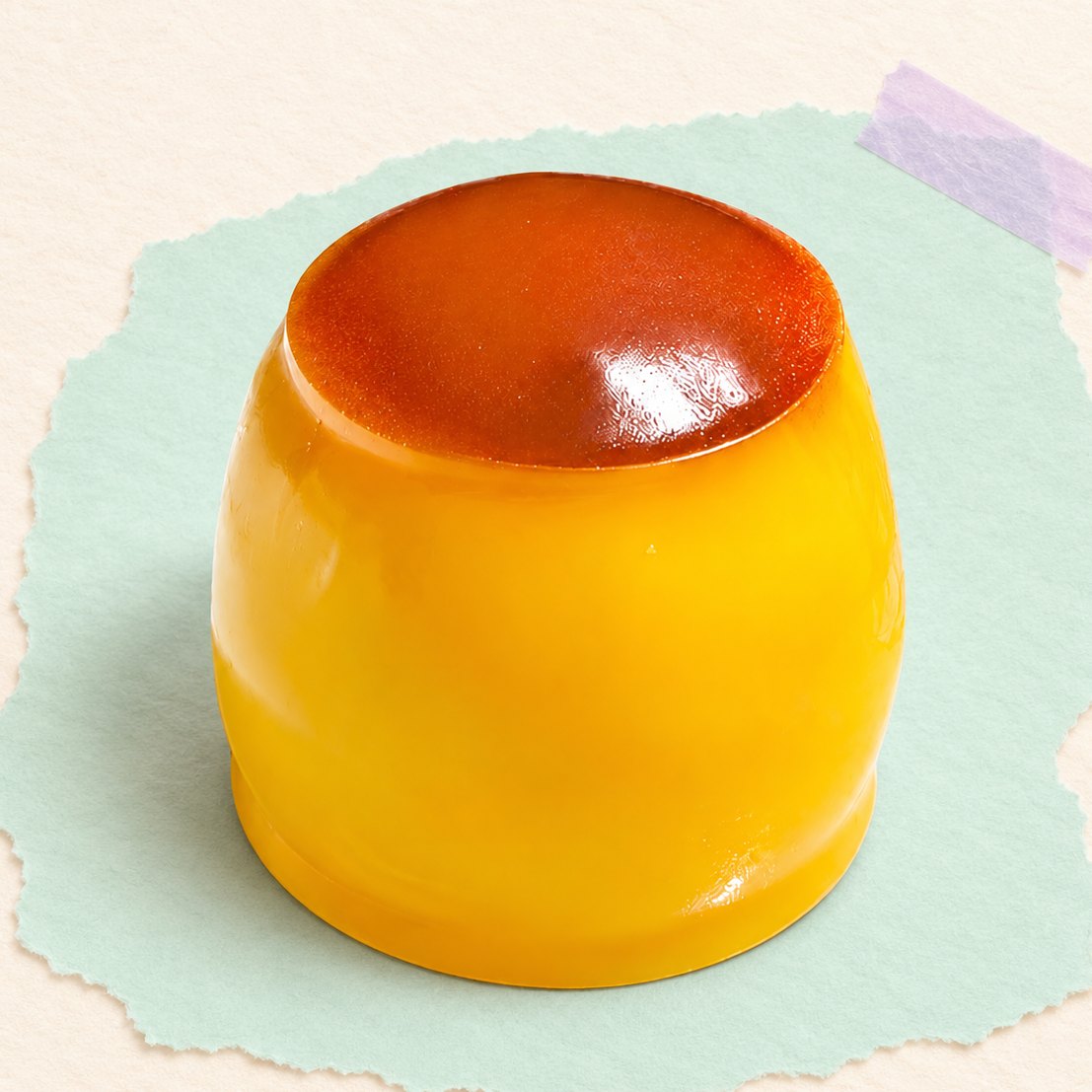 Pudding squishy met karameltopje op pastelkleurig papier