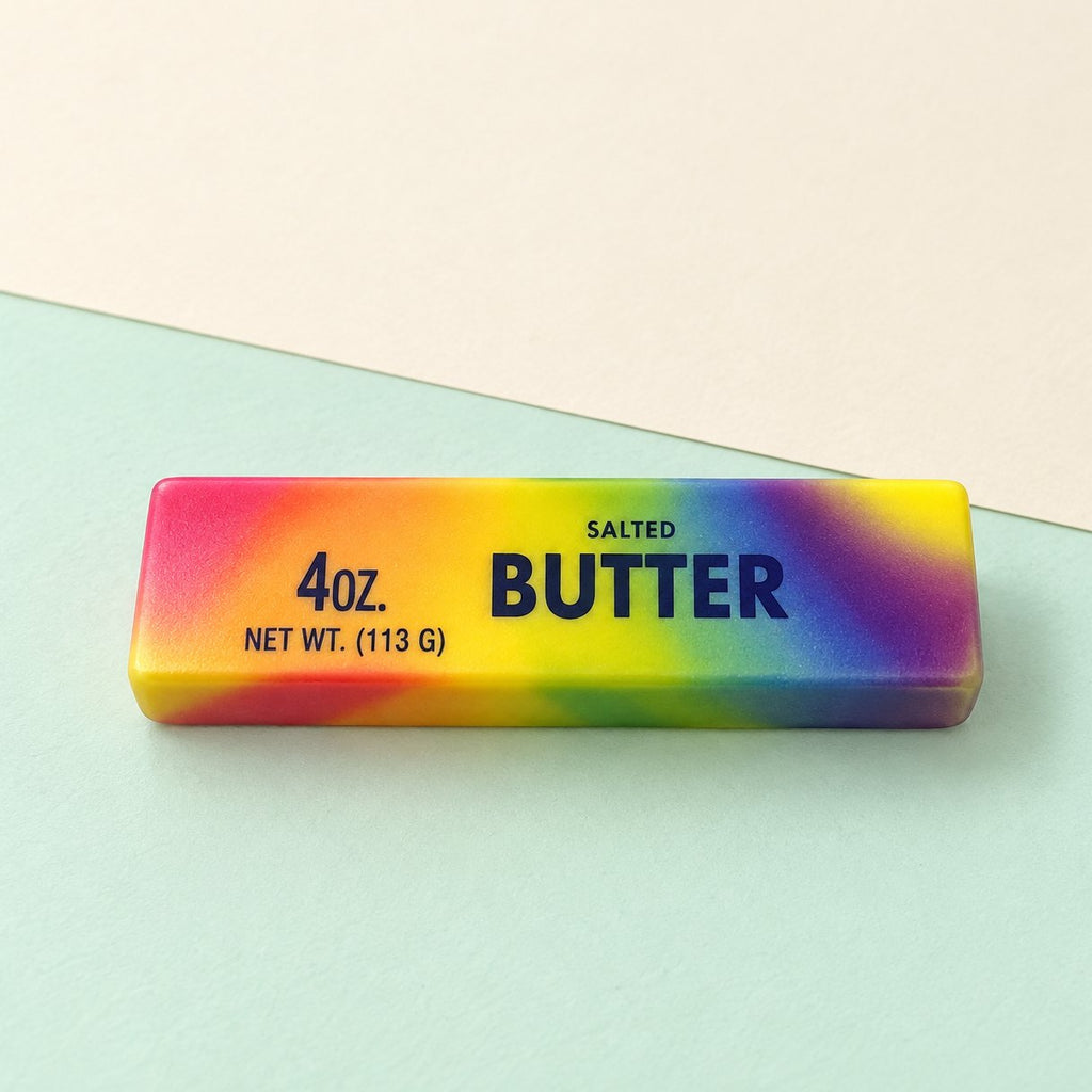 Regenbogen Butter Squishy, slow rising, 13,5 cm, auf Pastellpapier