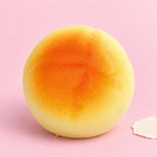 Round bun squishy – Round Bun Squishy, Small Bread Roll 6 cm, product photo on pastel paper