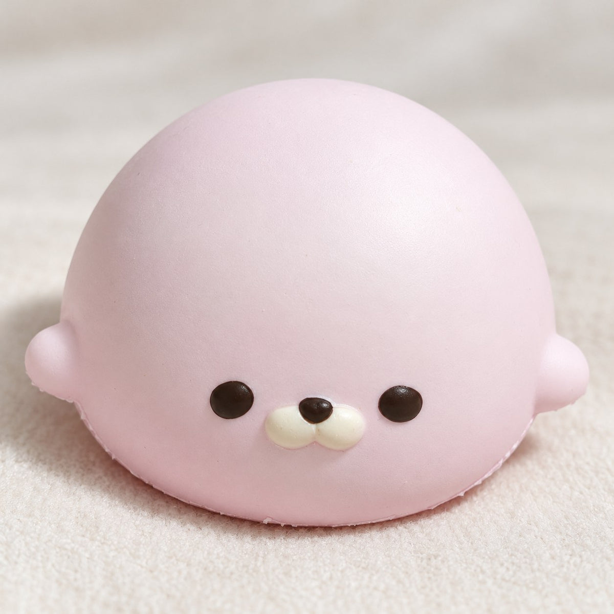 Seal Dumpling Squishy, Slow Rising PU (pink), close-up of the surface and details