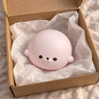 Seal Dumpling Squishy, Slow Rising PU (pink), unboxed from a parcel with tissue paper