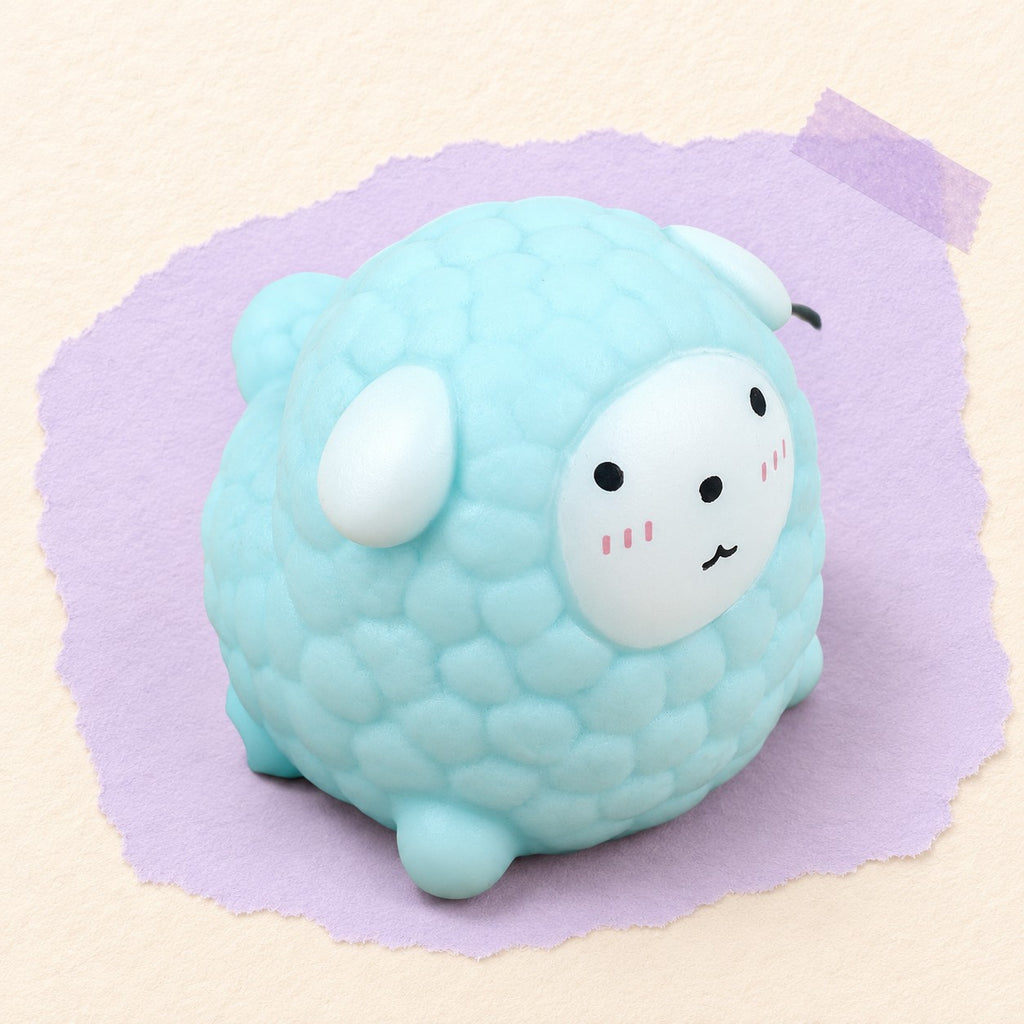 Sheep squishy soft – Sheep Squishy, Fluffy Lamb in Pastel TPR (Blue), product photo on pastel paper