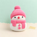 Schneemann squishy weihnachts – Schneemann Squishy, weich wie Mochi (Rosa, im Beutel), Produktfoto auf Pastellpapier
