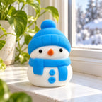 Snowman squishy (blue), on a sunny windowsill