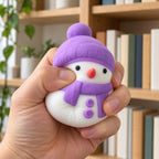 Snowman Squishy, Mochi Soft and Slow Rising (purple), being squeezed by hand, soft and squishy