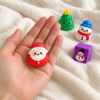 Squishy Advent Calendar with 24 Christmas Squishies, held toward the camera, first-person view