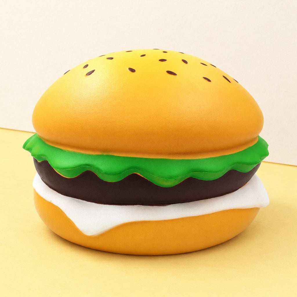 Squishy burger jumbo – ogromny burger z sezamem 24 cm na pastelowym papierze