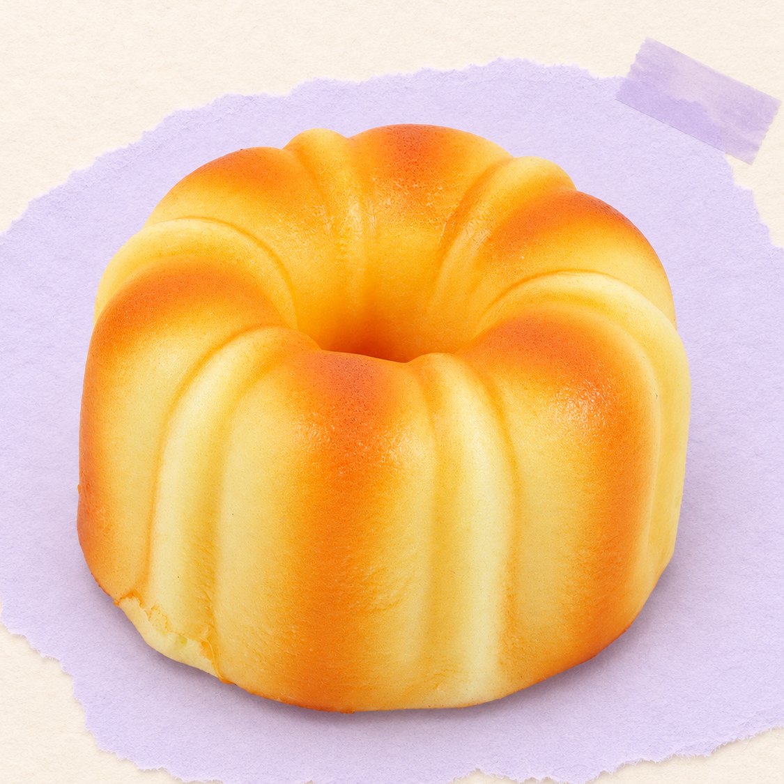 Squishy canelé, bolo francês de 9 cm, sobre papel cor pastel
