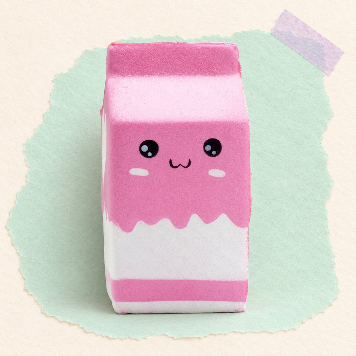 Squishy gigante de cartón de leche, slow rising, en rosa sobre papel pastel