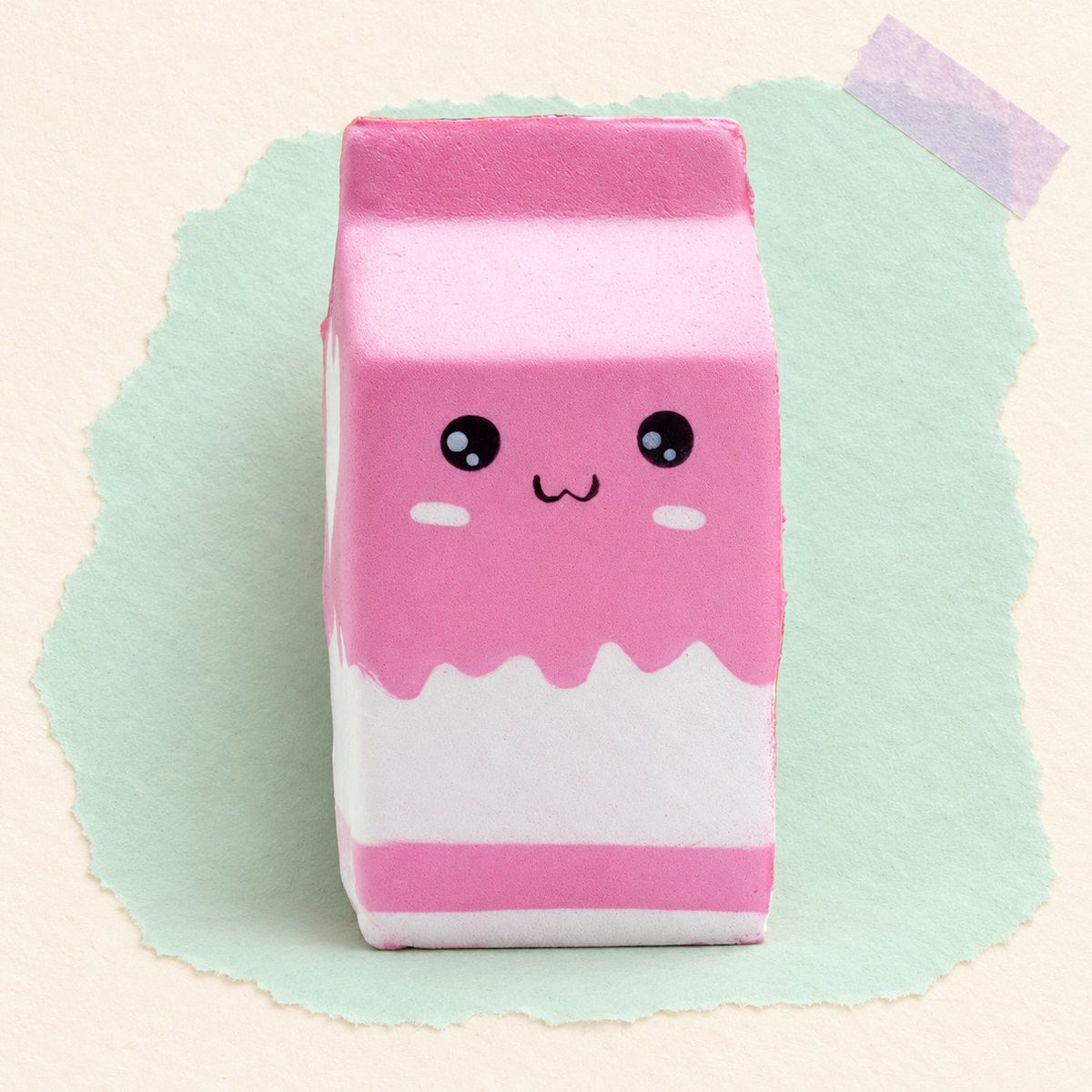 Squishy cartone del latte rosa slow rising, foto del prodotto su carta pastello
