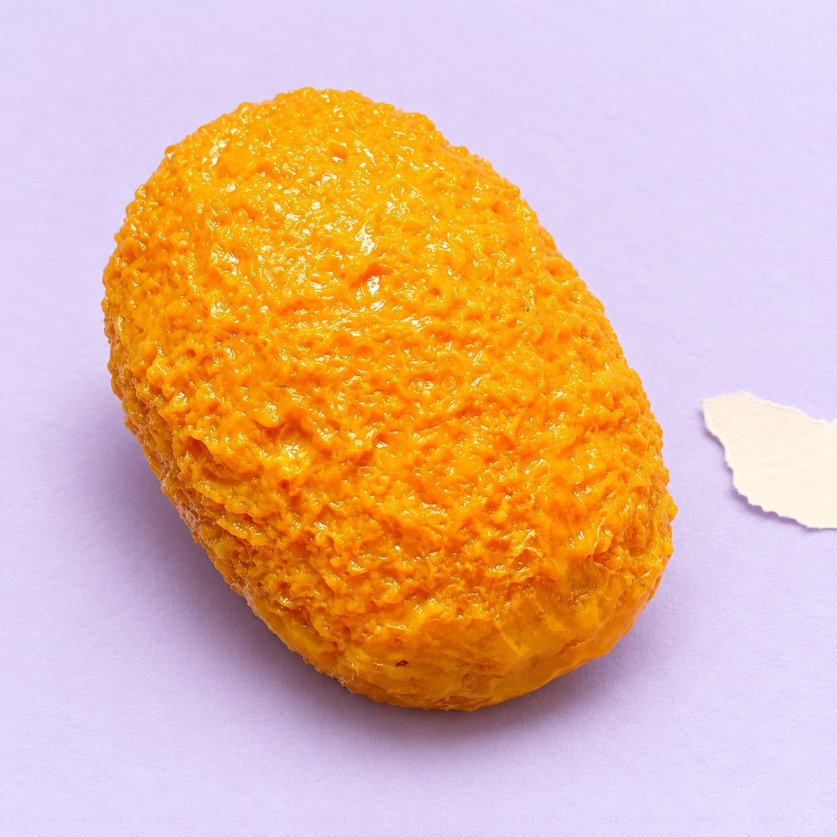 Squishy crocchetta fatto a mano, foto del prodotto su carta pastello