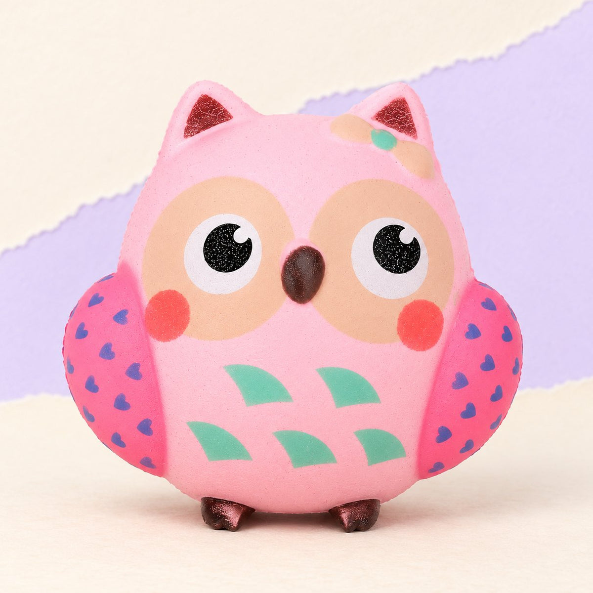 Squishy gufo rosa, foto del prodotto su carta pastello