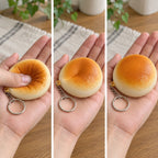 Squishy Keychain, Bread Bun Slow Rising, 4 or 7 cm (Golden bun, 7 cm), squished flat, half risen and fully back in shape
