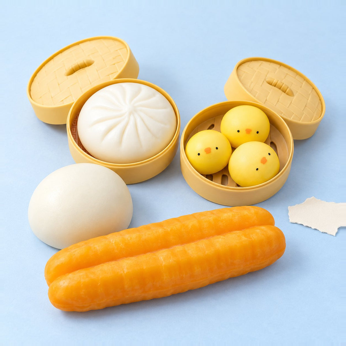Squishy knedlík sada se 4 knedlíčky na pastelovém papíře