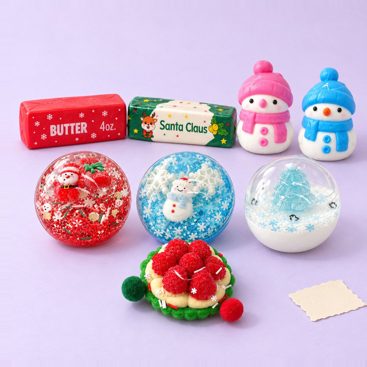Squishy Navidad kawaii: caja con 8 squishies sobre papel pastel