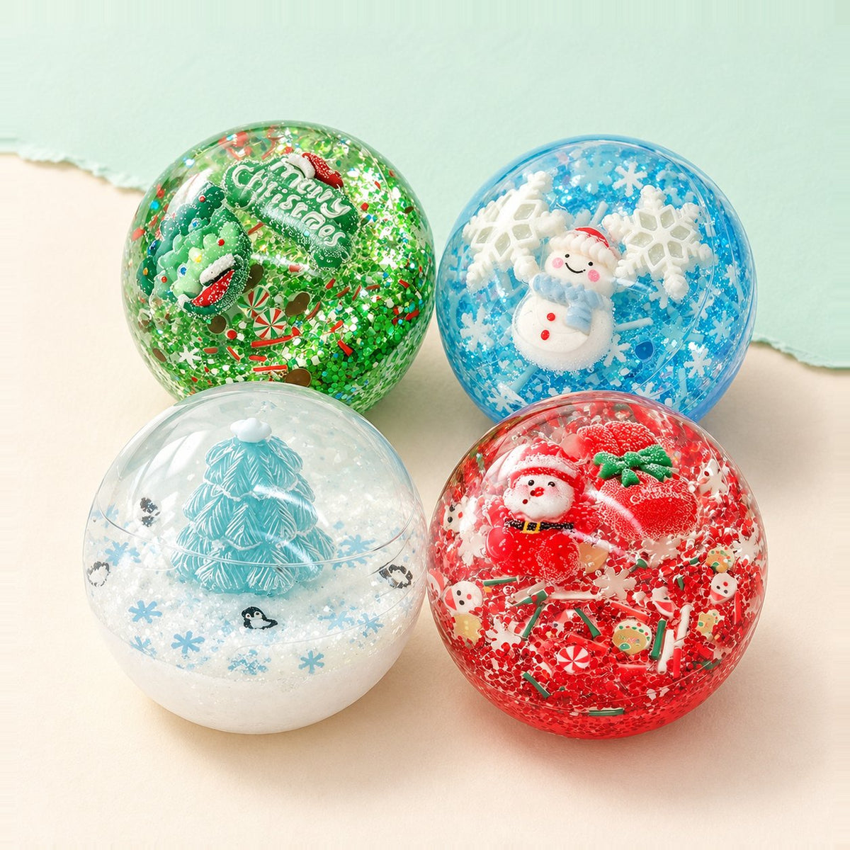 Squishy pallina di Natale set: tutti e 4 i motivi su carta pastello